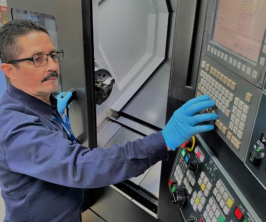 Factory worker on keypad